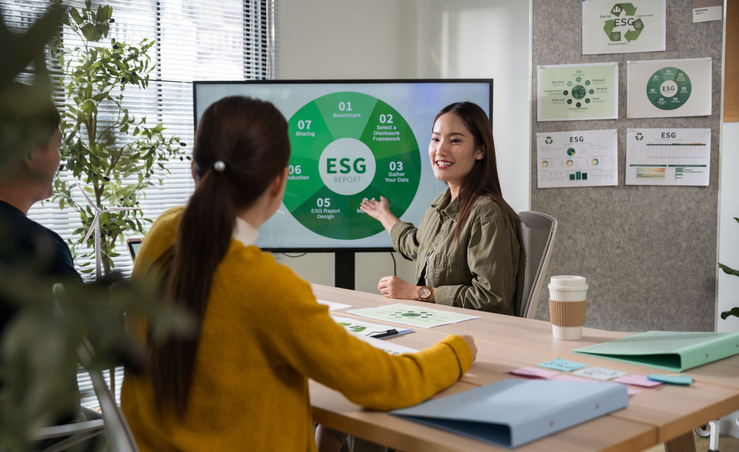 Asian business leaders meeting ESG strategize on sustainable environmental practices