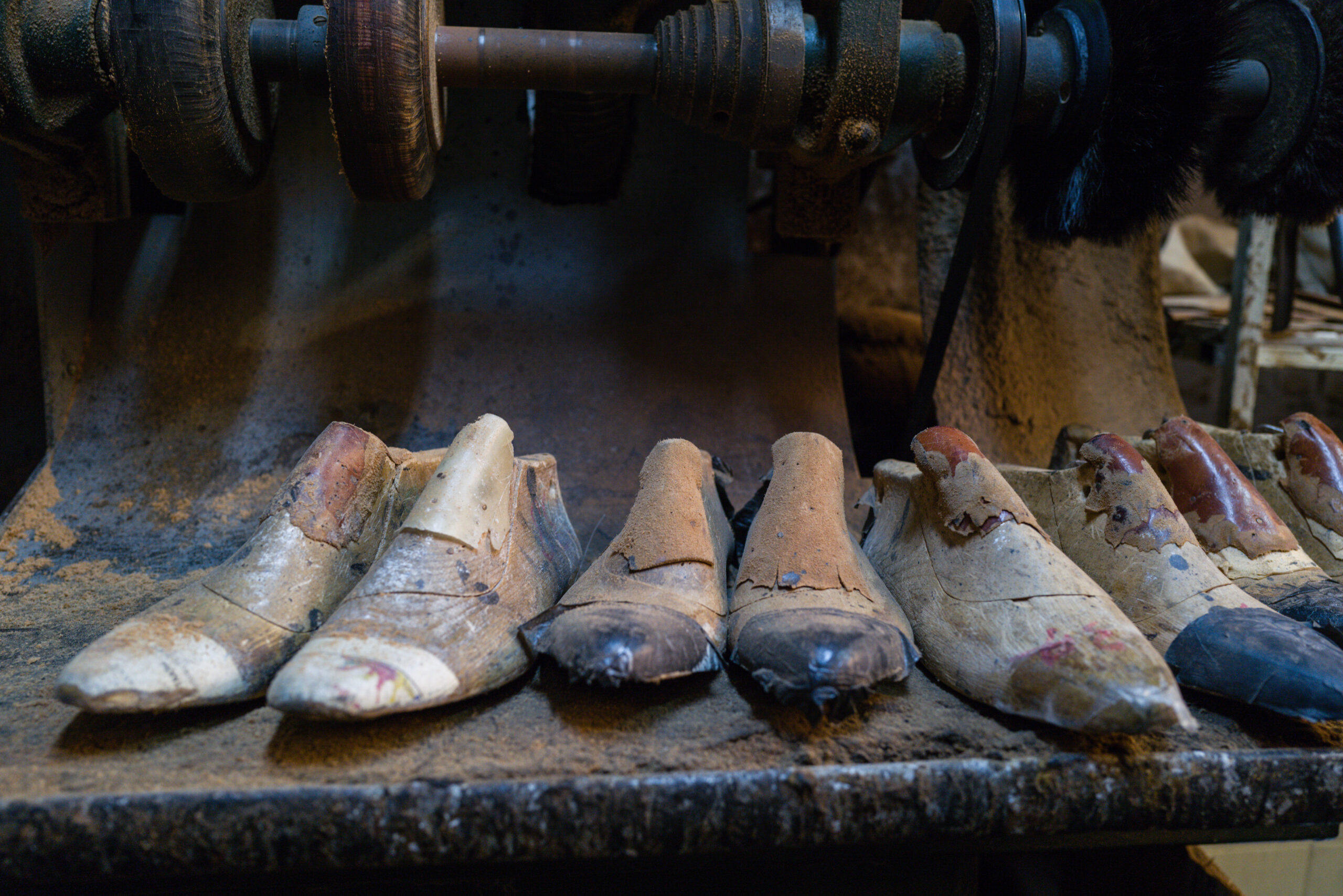 Wooden shoe models lined up in the shoe workshop